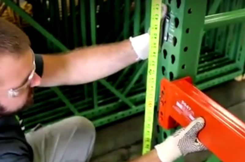 Measuring and installing arms on pallet racking system